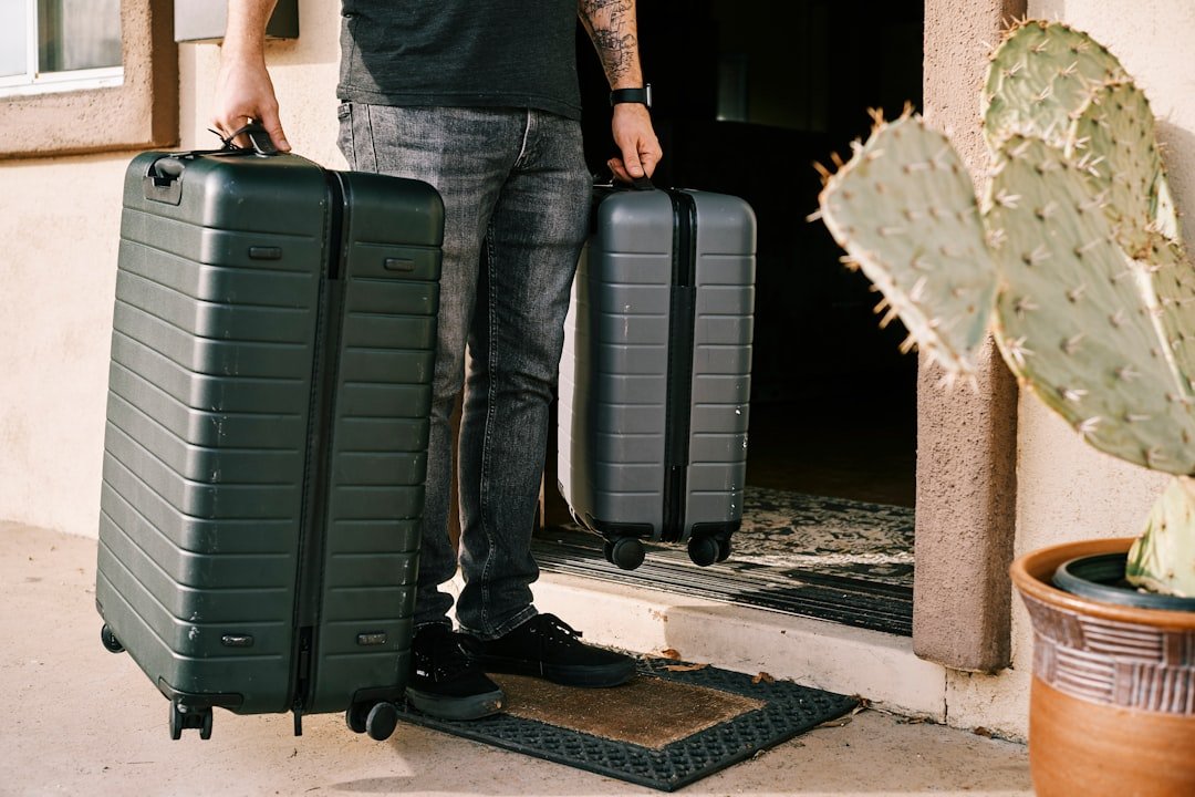A neatly packed suitcase with organized clothing and travel essentials, showcasing smart packing techniques.