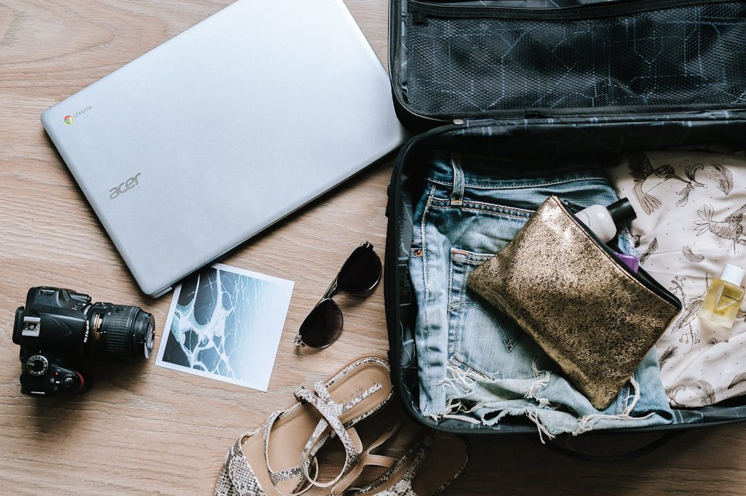 A neatly organized travel bag with cables, chargers, and small accessories arranged in an orderly fashion.