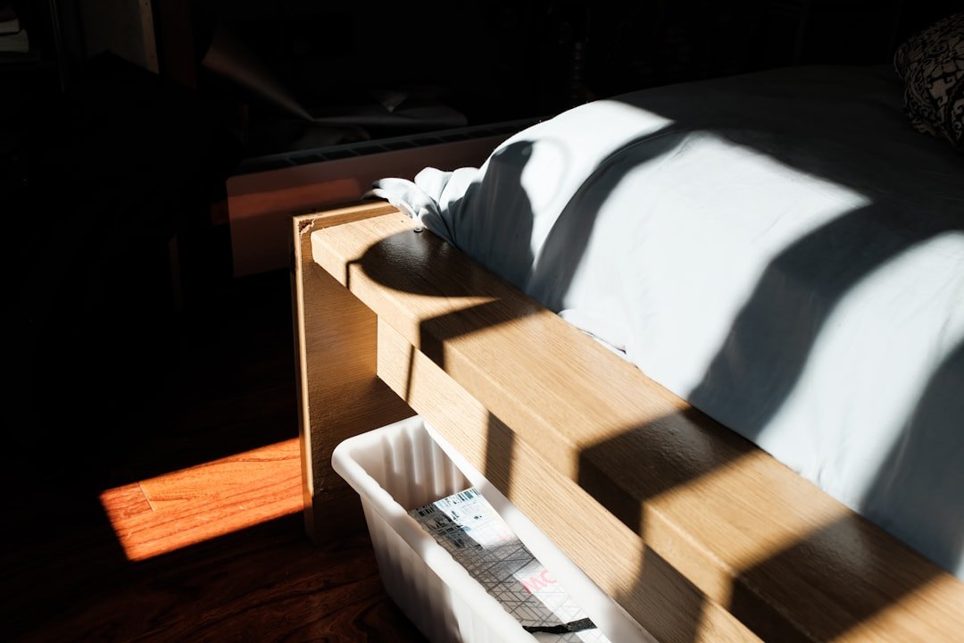 A neatly organized under-bed storage area with bins and boxes, showcasing efficient use of space without clutter.